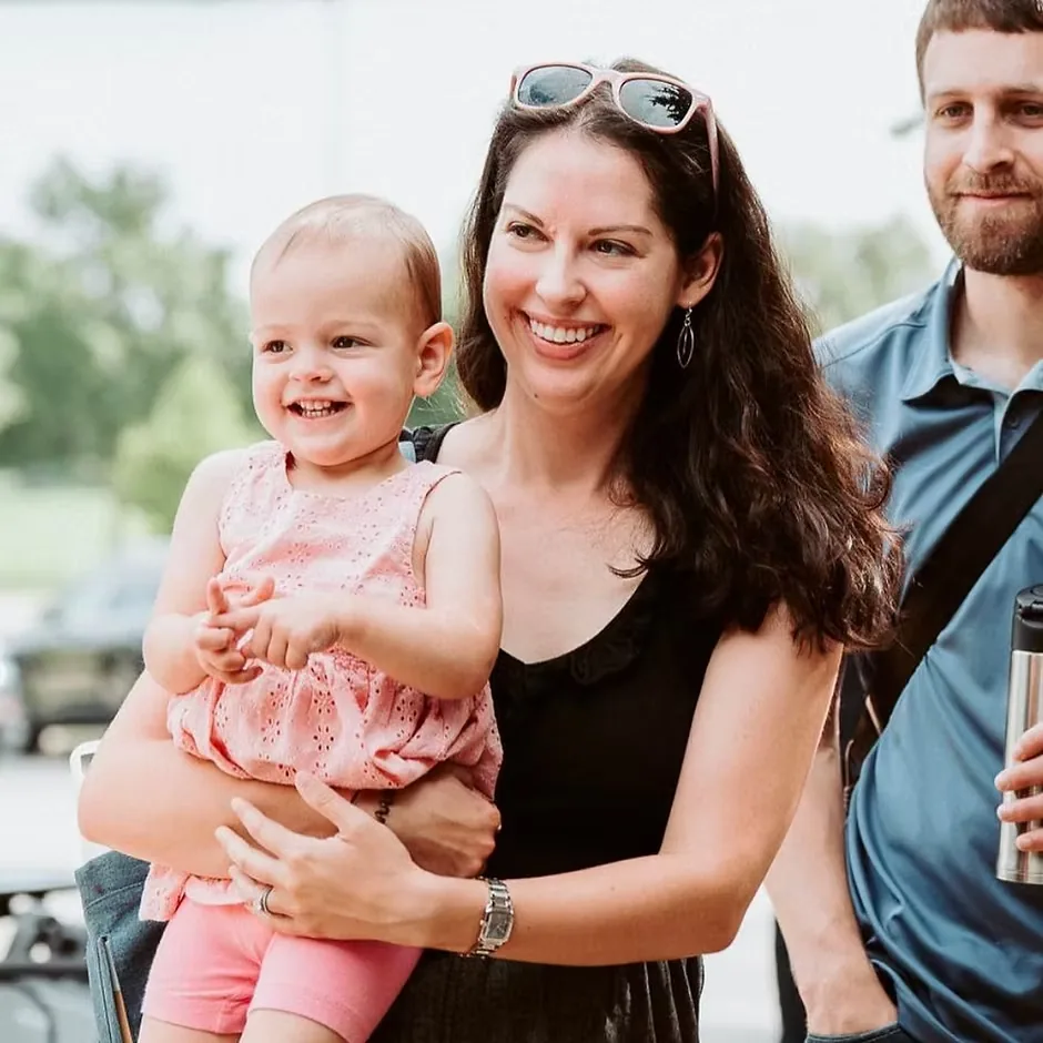 Mom holding her smiling toddler at Nuvo Church, a family-friendly church in Dublin, Ohio