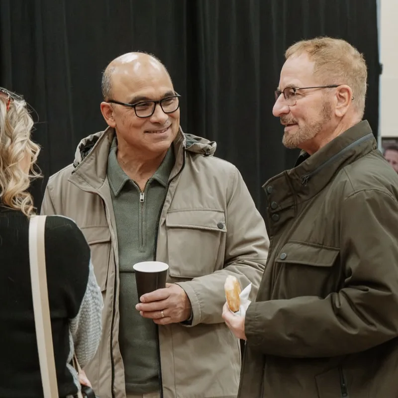 Friends talking over coffee and donuts on a Sunday at Nuvo Church in Dublin, Ohio