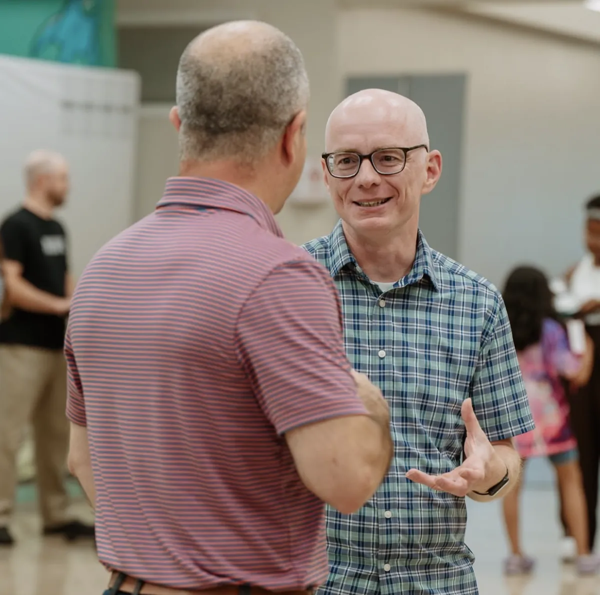 Two men talking and connecting on a Sunday at Nuvo Church in Dublin, Ohio
