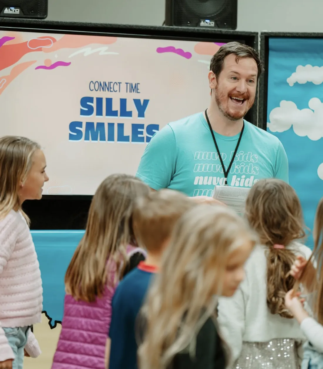 Nuvo Kids leader leading a fun connect-time game with elementary kids at church in Northwest Columbus