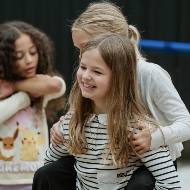 Elementary-age friends laughing together at Nuvo Kids in Columbus, Ohio