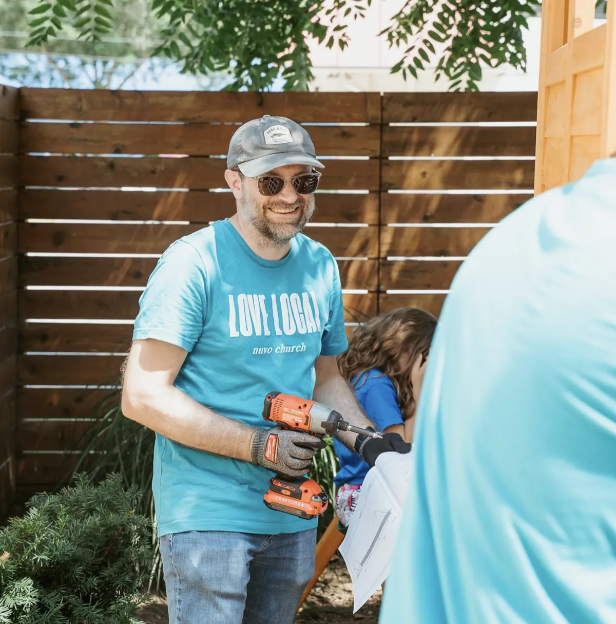 Nuvo Church Love Local volunteer with a drill building a playset for a family in Columbus, Ohio
