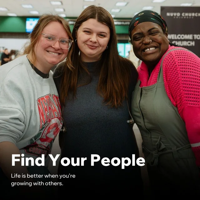 Three friends smiling together in the lobby at Nuvo Church, finding community in Dublin and Columbus, Ohio