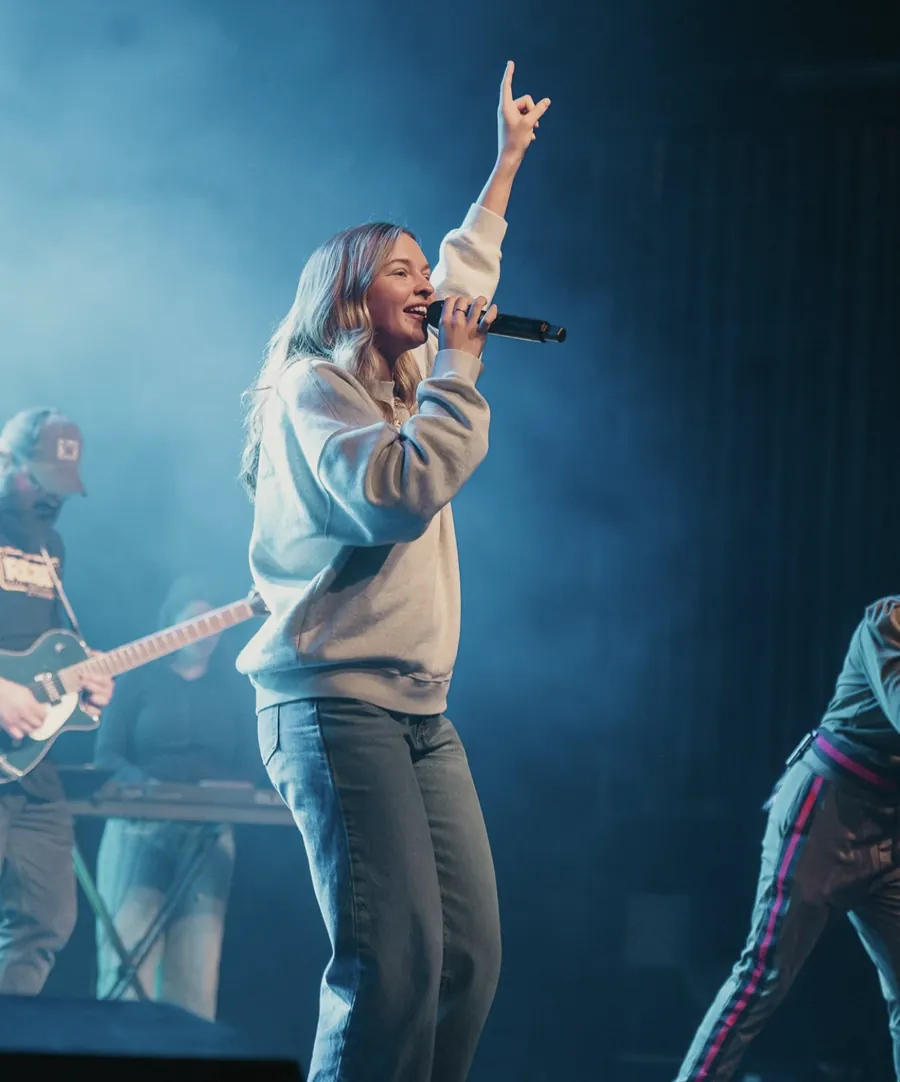 Nuvo Church worship team singer leading worship on stage in Columbus, Ohio