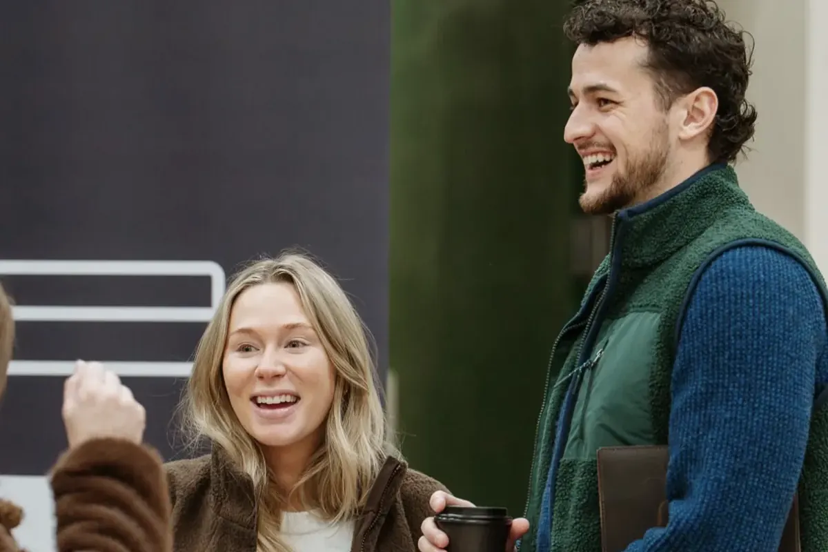 People welcoming a first-time guest on a Sunday at Nuvo Church