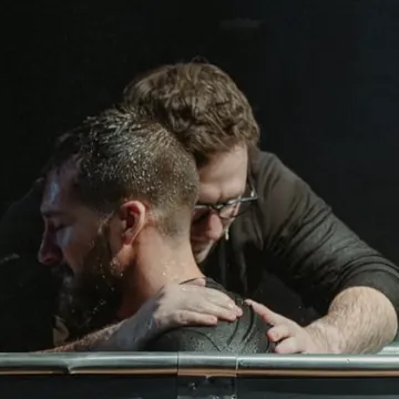 A man being baptized by a pastor at Nuvo Church