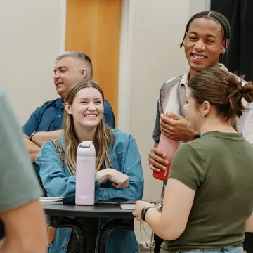Nuvo Church volunteers laughing together on a Sunday