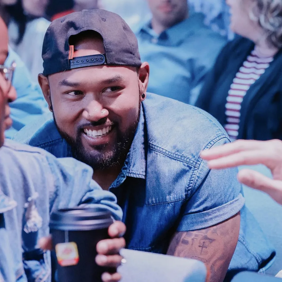 Malachai smiling with friends on a Sunday at Nuvo Church in Columbus, Ohio