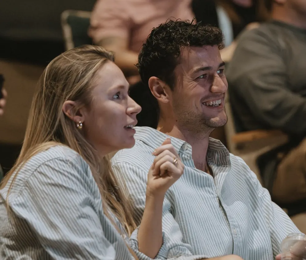 Couple laughing during a Sunday service at Nuvo Church in Columbus, Ohio