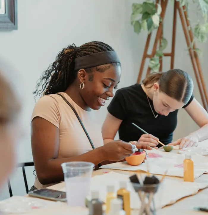 Teen girls painting together at a Nuvo YTH art night in Dublin, Ohio