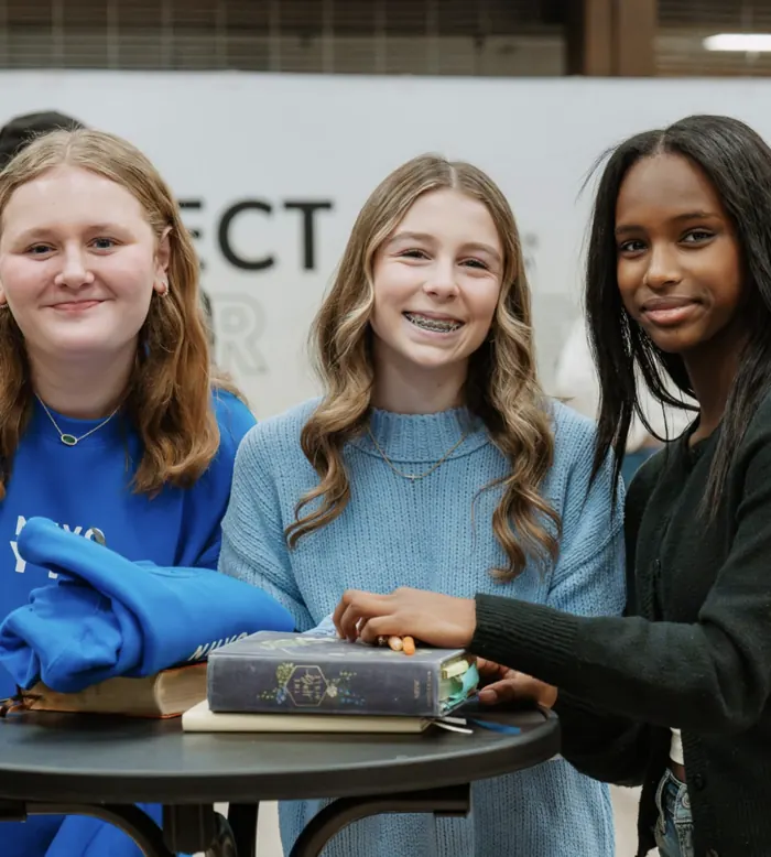 Three teen girls with their Bibles at Nuvo YTH, a youth group at Nuvo Church in Dublin, Ohio